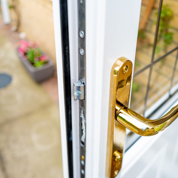 Shallow focus of the brass coloured door handle on a newly insta Shallow focus of the brass coloured door handle on a newly insta