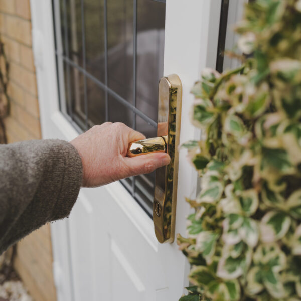 Homeowner opening a rear of property double glazed and leaded wi Homeowner opening a rear of property double glazed and leaded wi